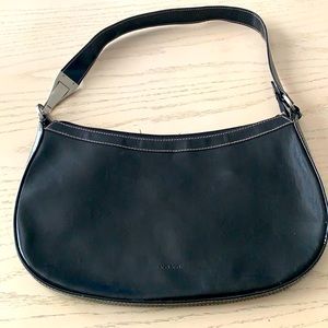 Black XOXO medium size shoulder purse.